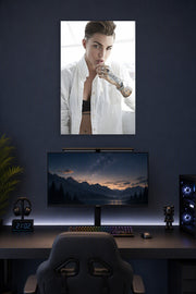 Ruby Rose in a gaming desk setup above a monitor.