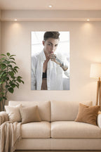 Ruby Rose in a bright living room above a beige sofa.