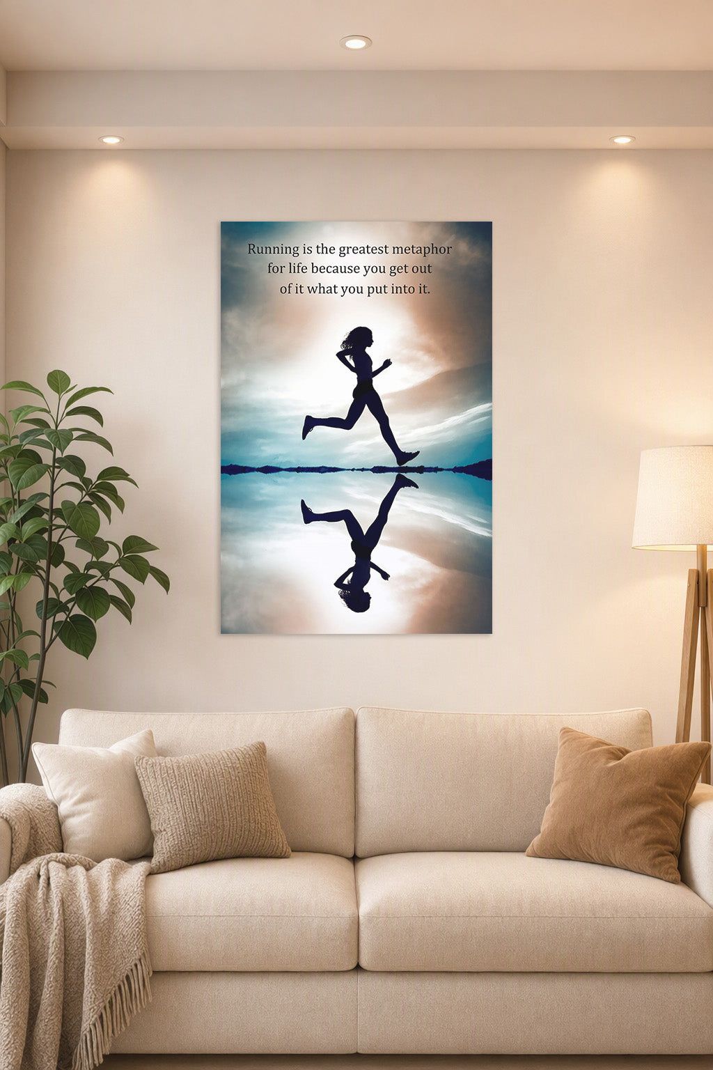 Running Silhouette Motivational Quote in a bright living room above a beige sofa.