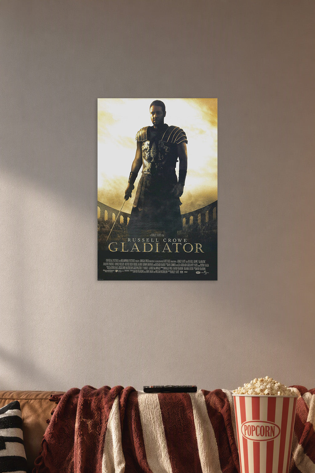 Russell Crowe Gladiator Movie in a cozy movie room above a brown sofa with popcorn.