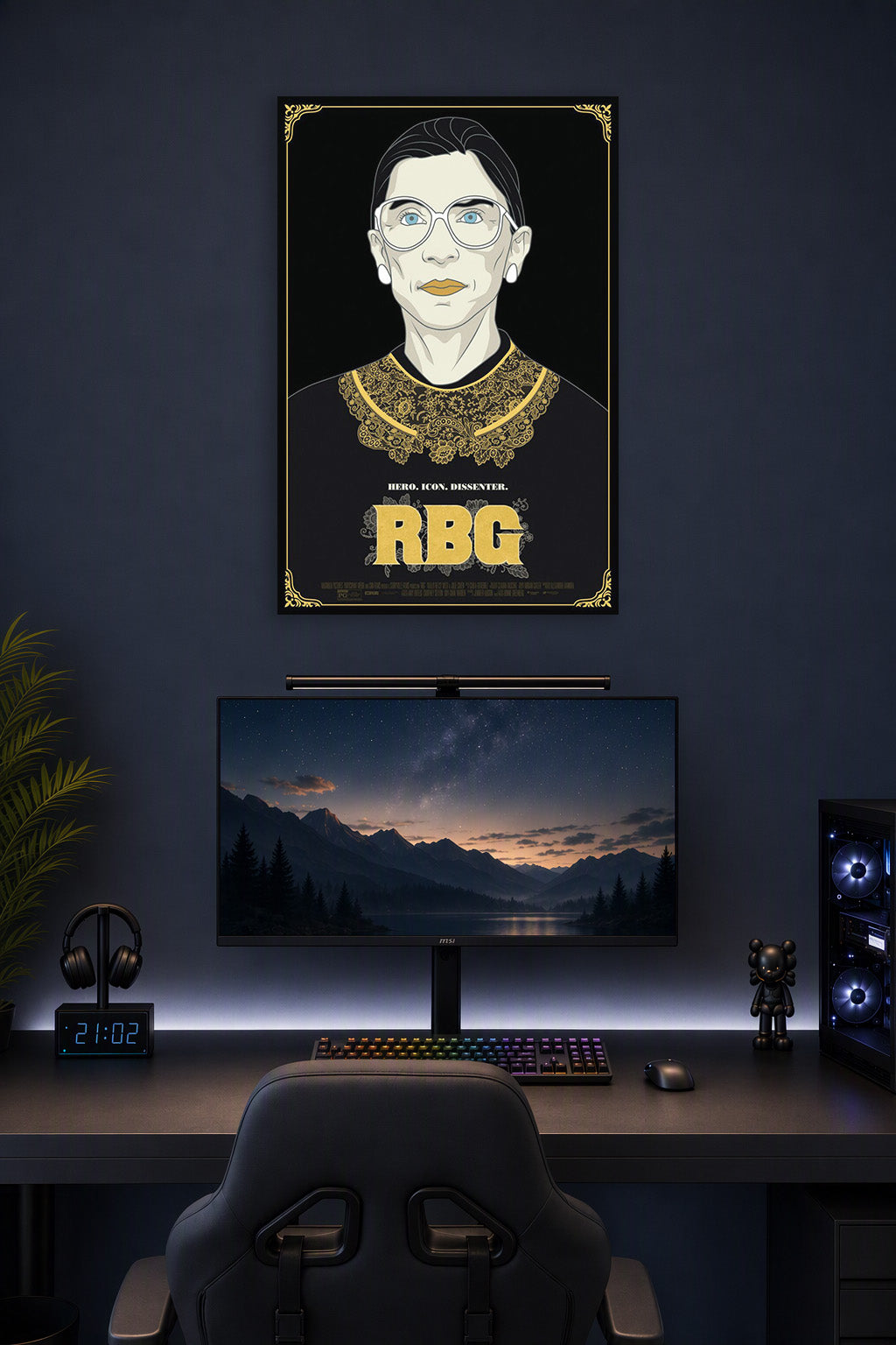 Ruth Bader Ginsburg in a gaming desk setup above a monitor.