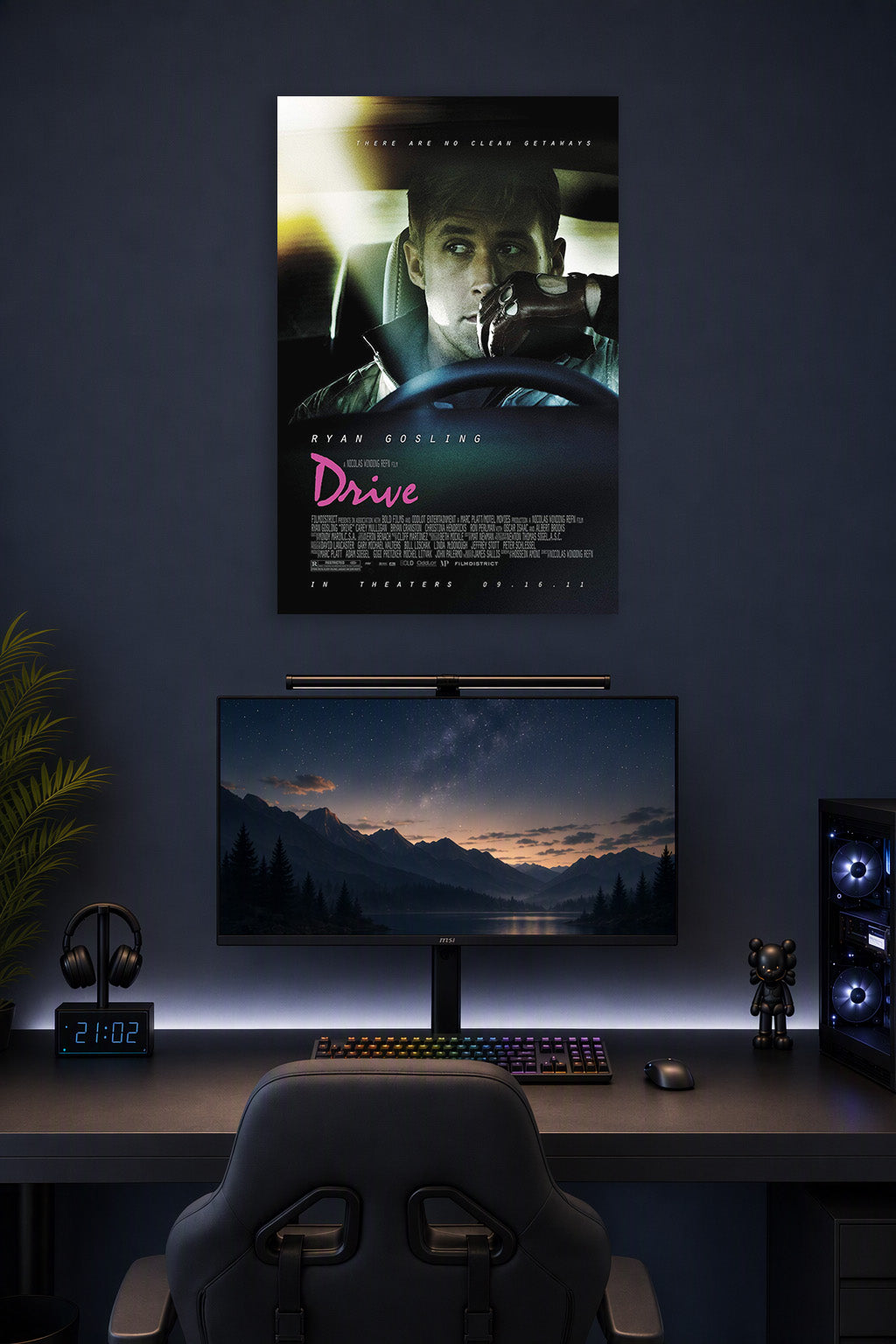 Ryan Gosling Drive Movie in a gaming desk setup above a monitor.
