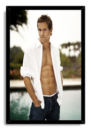 Ryan Reynolds framed wall art print features a poolside portrait, open white shirt and dark jeans in a black frame.