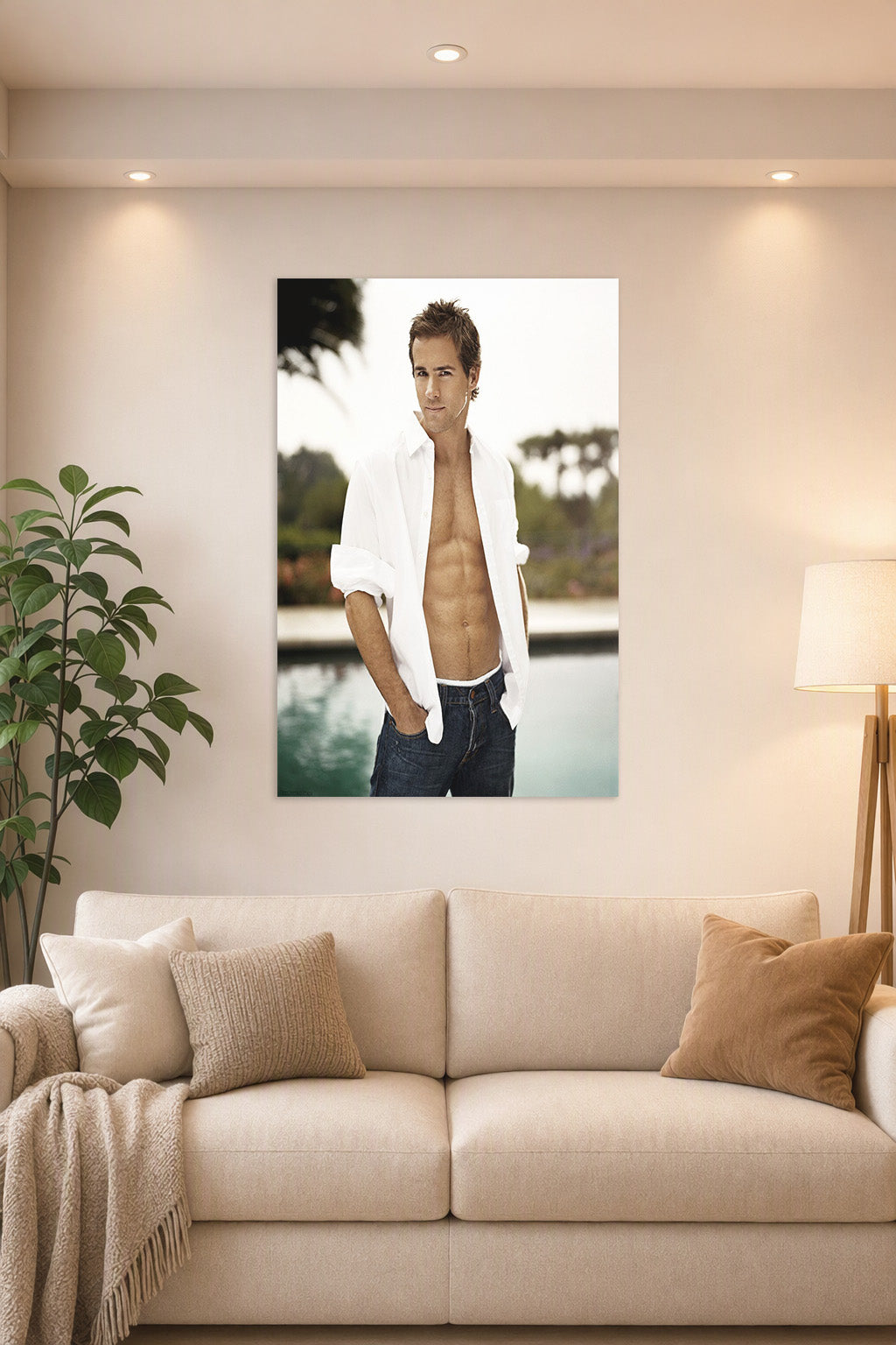 Ryan Reynolds in a bright living room above a beige sofa.