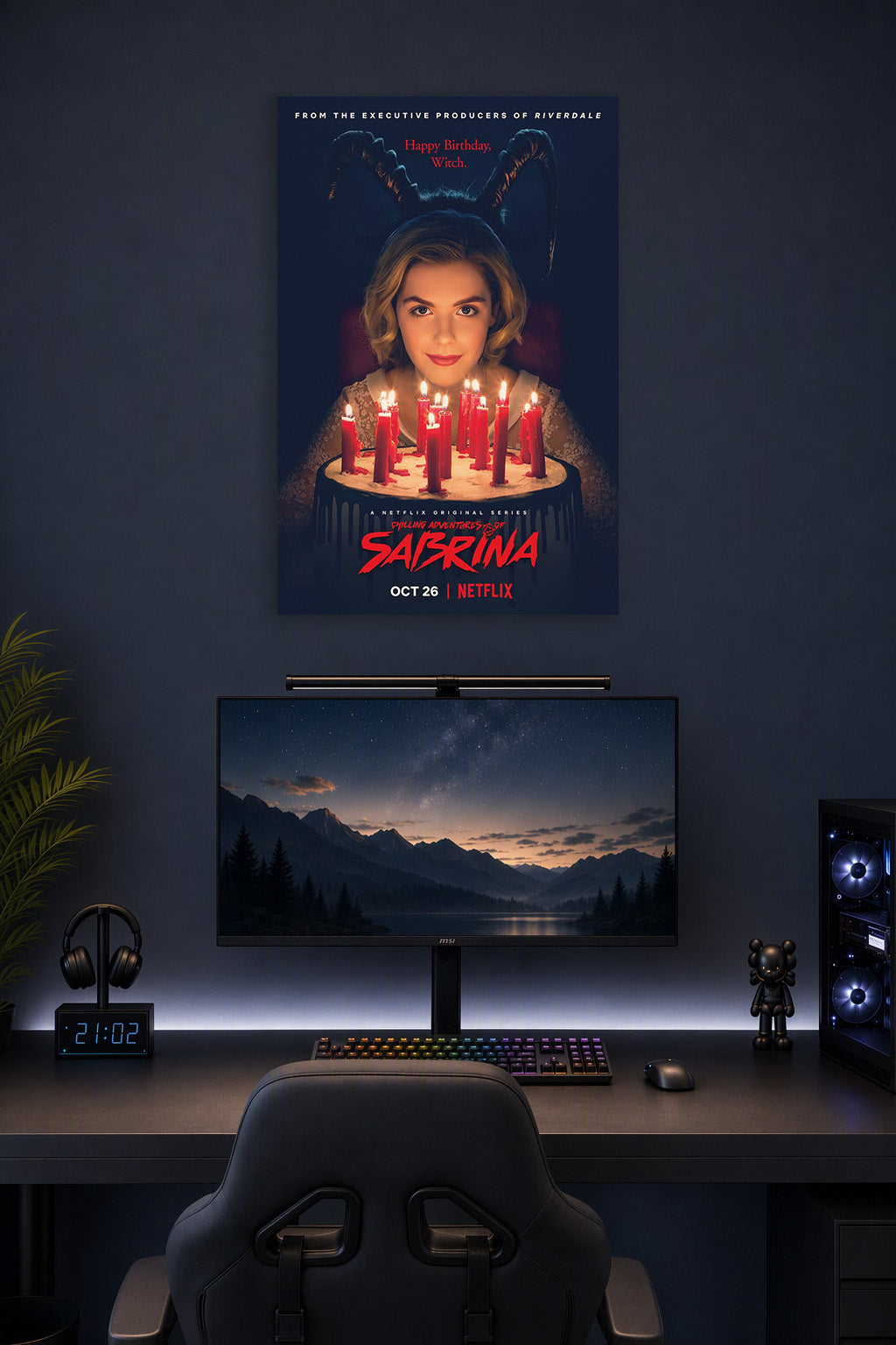 Sabrina Spellman Chilling Adventures of Sabrina in a gaming desk setup above a monitor.
