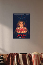 Sabrina Spellman Chilling Adventures of Sabrina in a cozy movie room above a brown sofa with popcorn.
