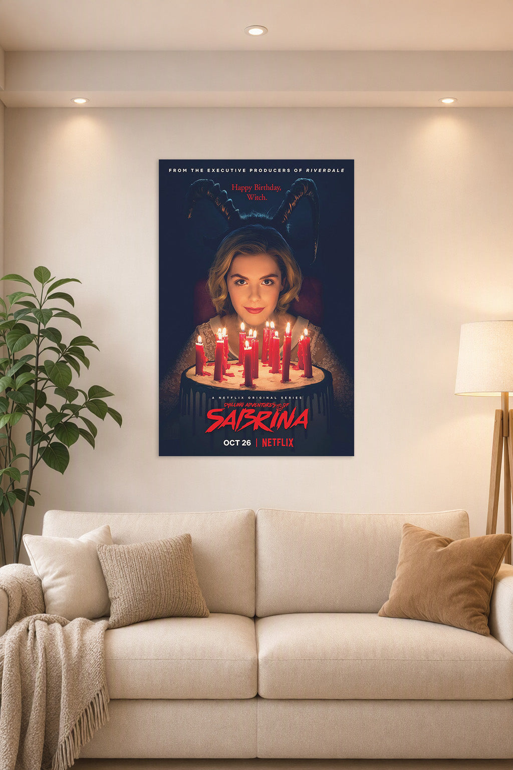 Sabrina Spellman Chilling Adventures of Sabrina in a bright living room above a beige sofa.