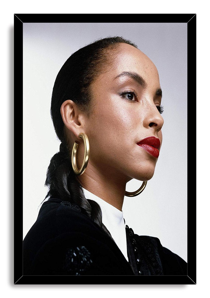 Sade Adu framed wall art print featuring her poised side-profile portrait with gold hoop earrings and red lipstick.