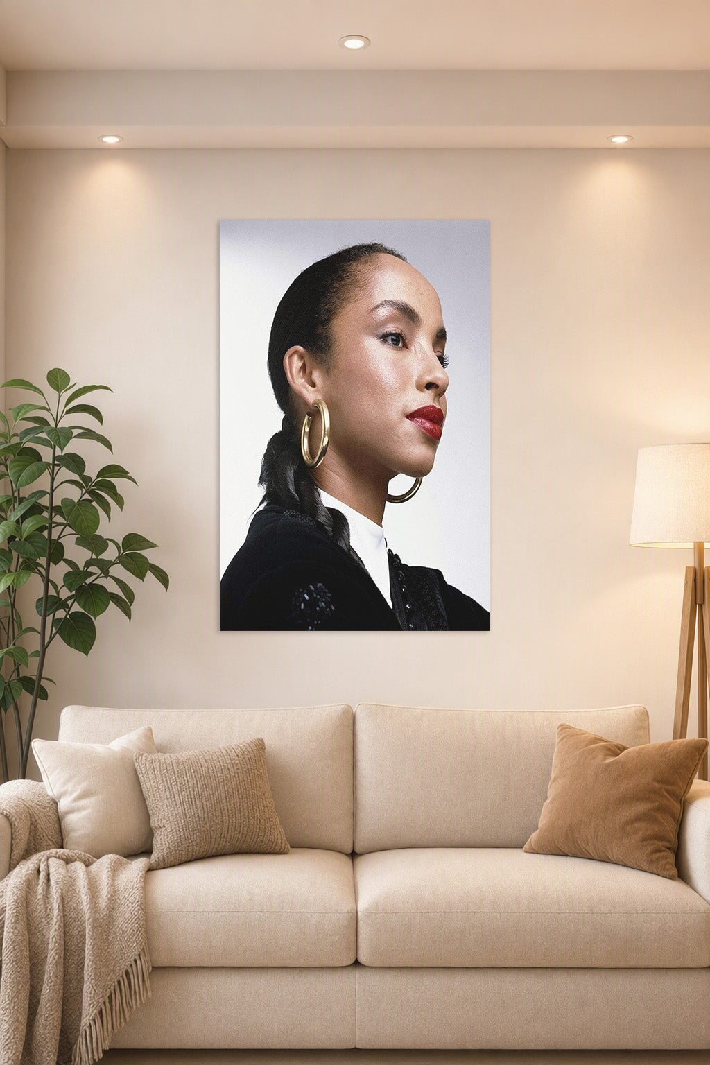 Sade Adu in a bright living room above a beige sofa.