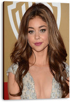 Sarah Hyland canvas wall art print displays her close-up portrait in a silver gown against a gold and white event backdrop.