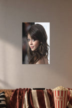Sarah Hyland in a cozy movie room above a brown sofa with popcorn.