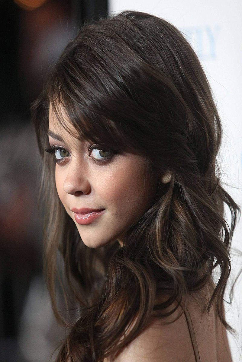 Sarah Hyland wall art print with a close-up portrait of the actress in wavy dark brown hair and soft makeup.