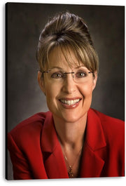 Sarah Palin canvas wall art print displays her smiling portrait with glasses, red blazer, and dark gray studio backdrop.