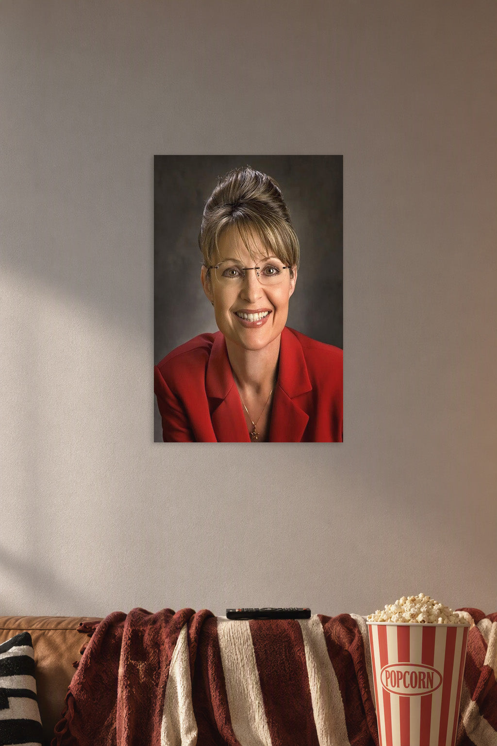 Sarah Palin in a cozy movie room above a brown sofa with popcorn.
