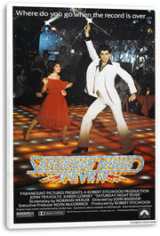 Saturday Night Fever canvas wall art print displays John Travolta in a white suit and a woman in red beneath disco lights.