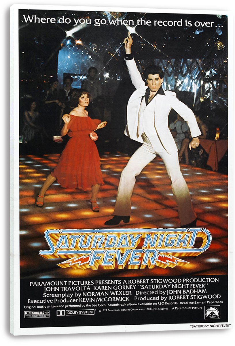 Saturday Night Fever canvas wall art print displays John Travolta in a white suit and a woman in red beneath disco lights.