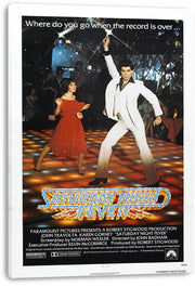 Saturday Night Fever movie poster canvas print featuring a white-suited dancer, a woman in red, sparkling nightclub lights, and bold title lettering.