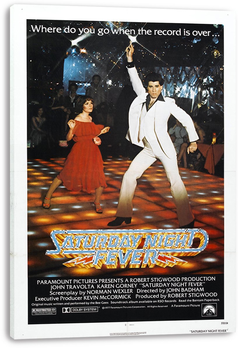 Saturday Night Fever movie poster canvas print featuring a white-suited dancer, a woman in red, sparkling nightclub lights, and bold title lettering.