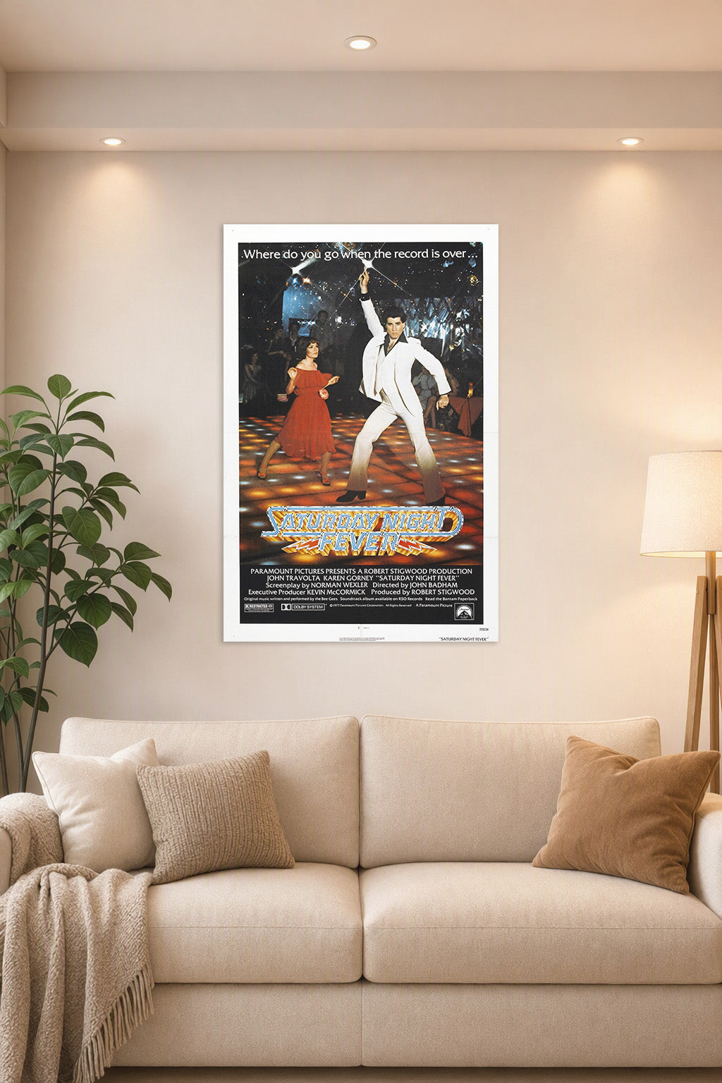 Saturday Night Fever Movie Poster in a bright living room above a beige sofa.