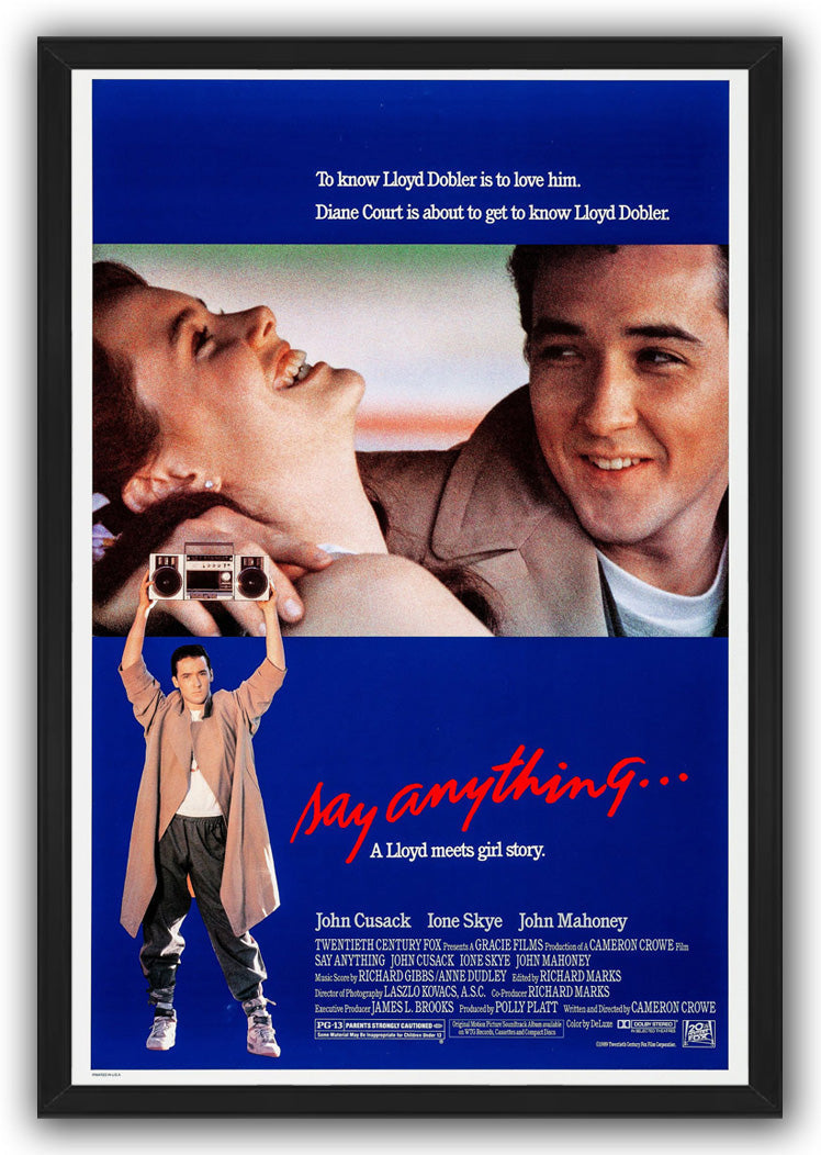 Say Anything framed wall art print with black border, a smiling couple, red script title, and boombox-holding man.
