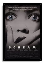 Scream framed wall art print presents a grayscale terrified face with blue eyes and hand over mouth in a black frame.