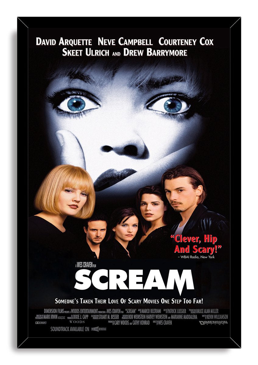 Scream framed wall art print presents a fearful blue-eyed face, cast portraits, red review text, and white title on black.