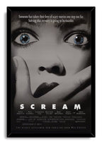 Scream movie poster wall art print in a black frame, featuring blue eyes, a covered mouth, and bold white title text.