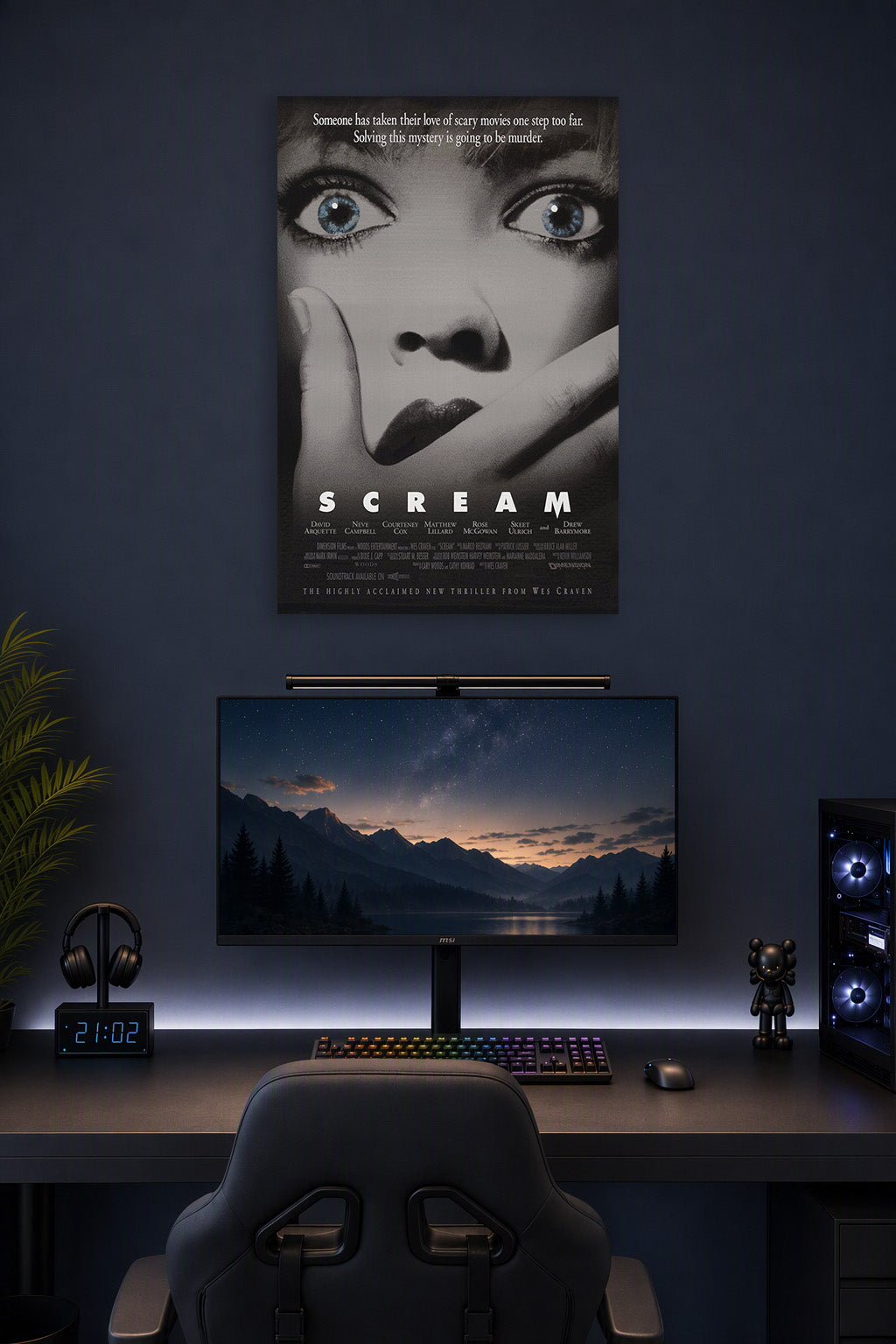 Scream Movie Poster in a gaming desk setup above a monitor.