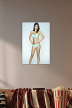 Selena Gomez in a cozy movie room above a brown sofa with popcorn.