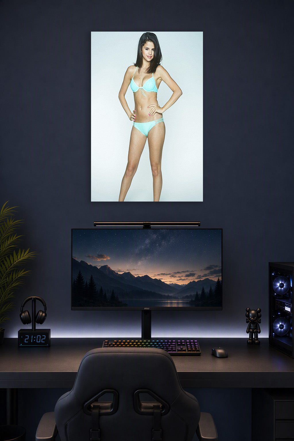 Selena Gomez in a gaming desk setup above a monitor.