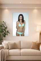 Selena Gomez in a bright living room above a beige sofa.