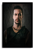 Tactical man framed wall art print features a focused bearded figure in a black tactical vest against a charcoal textured background.