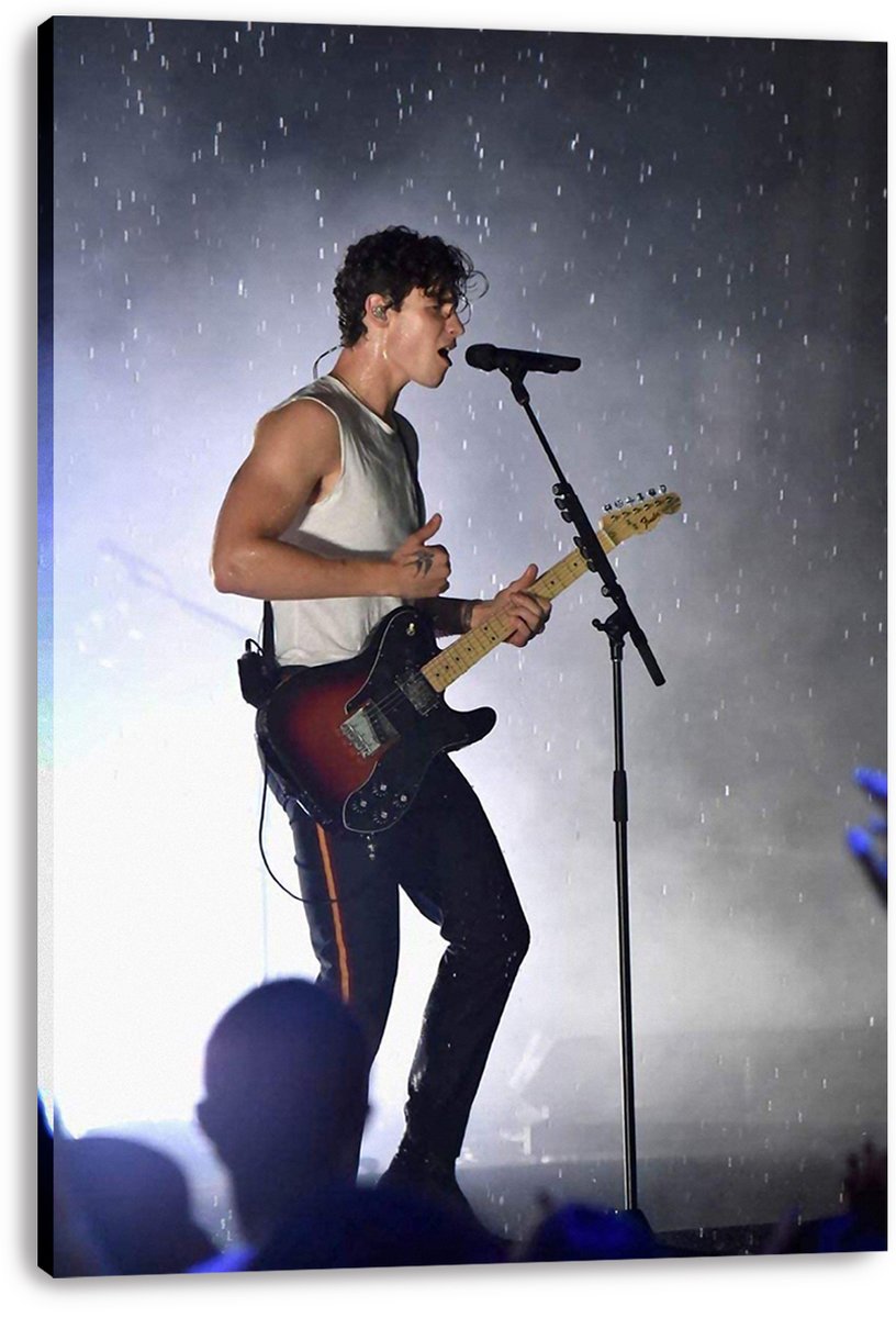 Shawn Mendes canvas wall art print displays the singer with an electric guitar beneath rain and smoky blue-gray stage lights.