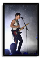 Shawn Mendes framed wall art print features the singer at a microphone playing a sunburst guitar in falling rain.