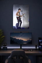 Shawn Mendes in a gaming desk setup above a monitor.