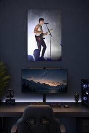 Shawn Mendes in a gaming desk setup above a monitor.