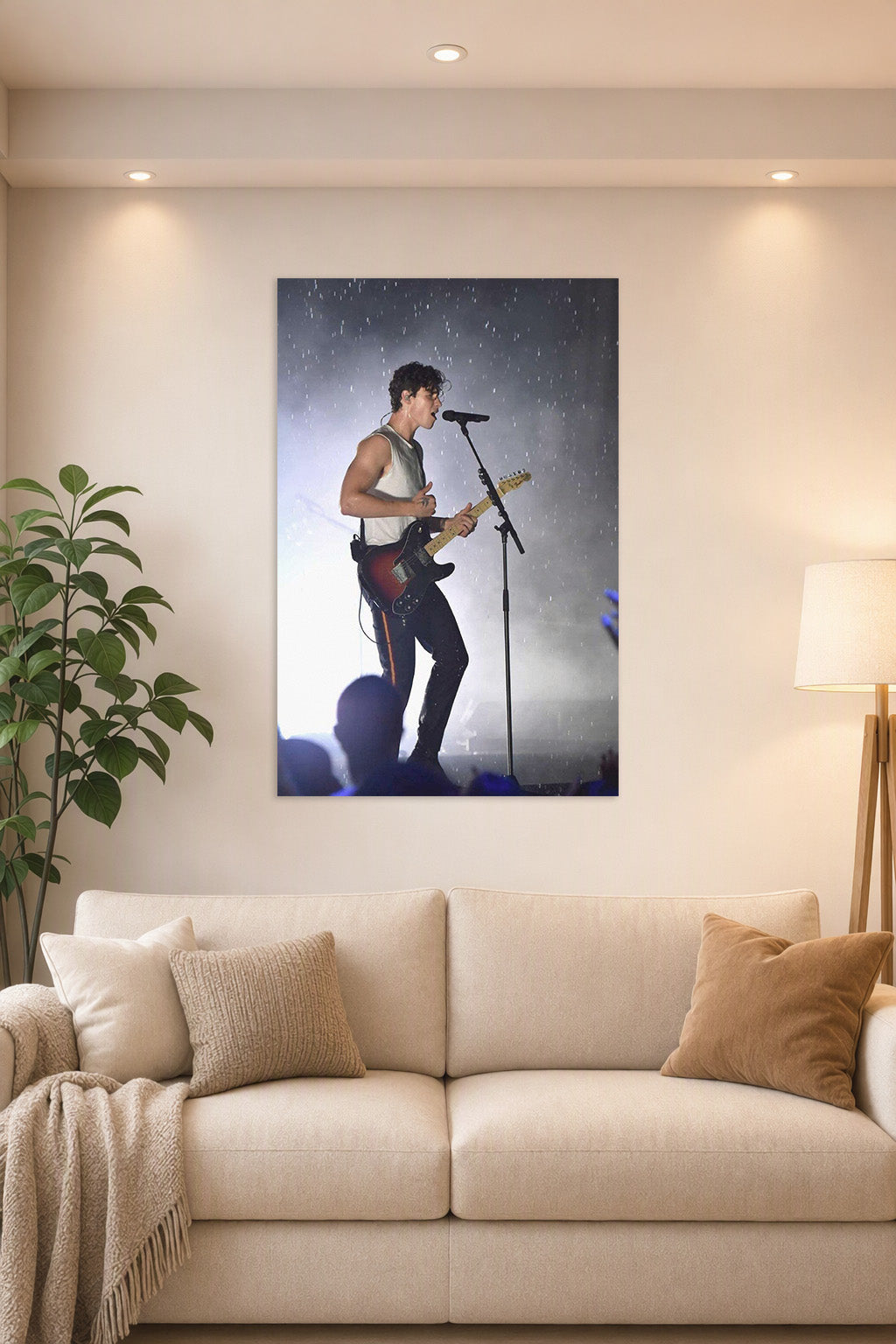 Shawn Mendes in a bright living room above a beige sofa.