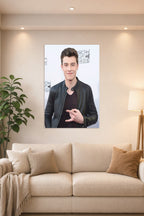 Shawn Mendes in a bright living room above a beige sofa.