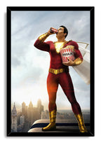 Shazam framed wall art print with a black border, depicting the hero in a red suit drinking soda beside a tub of popcorn.