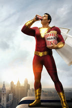 Shazam poster wall art print of the red-suited hero drinking from a soda can with IMAX popcorn above a city skyline.