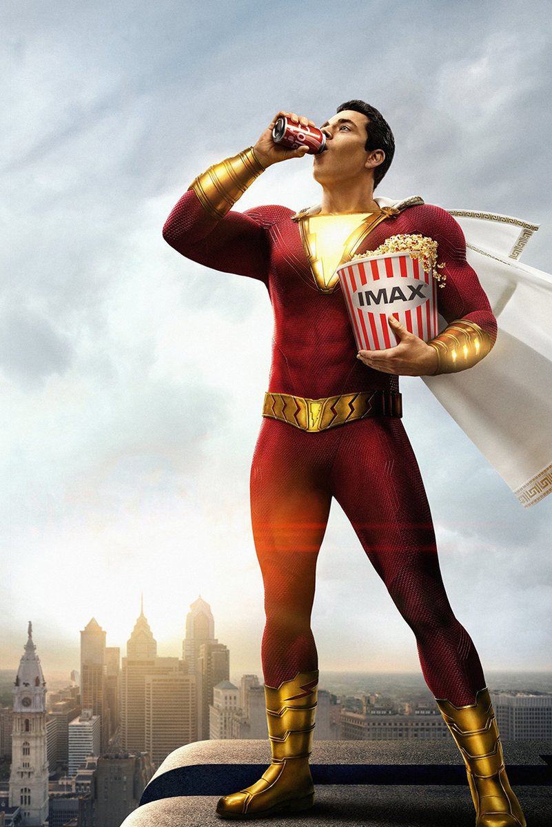 Shazam poster wall art print of the red-suited hero drinking from a soda can with IMAX popcorn above a city skyline.