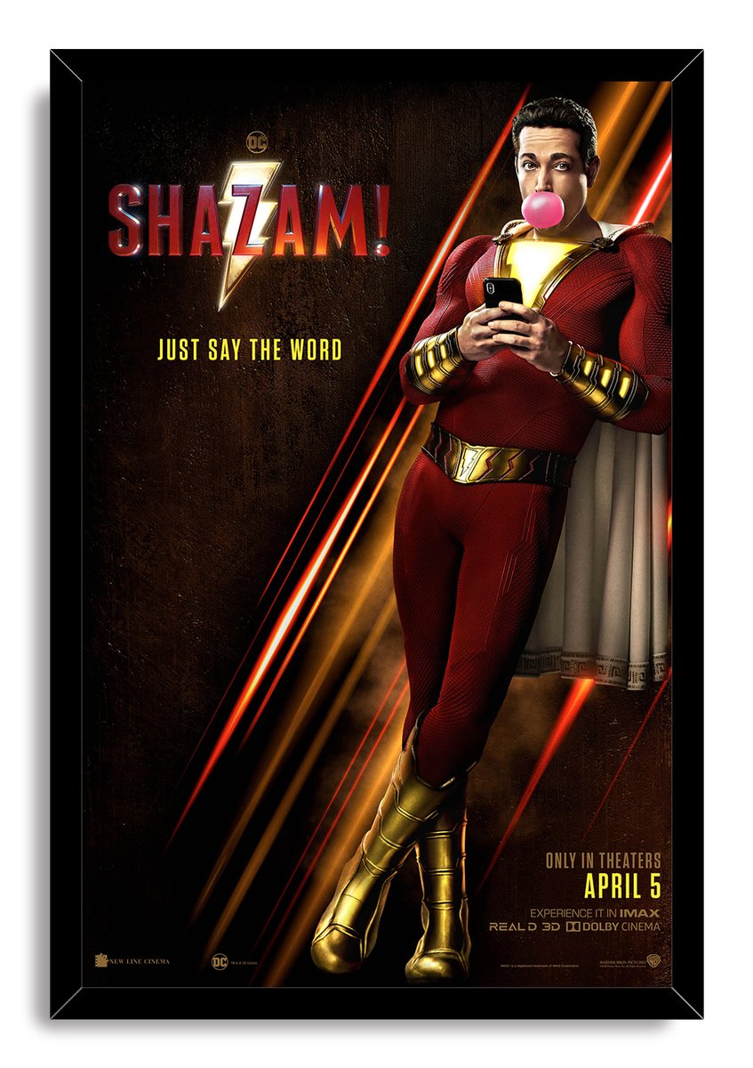Shazam! framed wall art print of the caped superhero holding a phone and blowing bubblegum, set against dark gold and red rays.