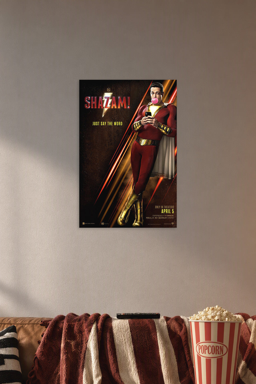 Shazam Movie in a cozy movie room above a brown sofa with popcorn.