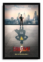 Shazam movie poster wall art print in a black frame, featuring a boy, city skyline, and superhero shadow with yellow bolt.