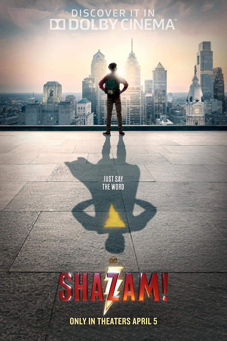 Shazam movie poster wall art print of a boy overlooking a city skyline, casting a superhero shadow with a yellow lightning bolt.