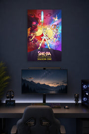 She-Ra and the Princesses of Power in a gaming desk setup above a monitor.