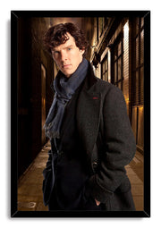 Sherlock Holmes framed wall art print depicts a serious man in a textured dark coat and blue scarf in a dim urban passage.