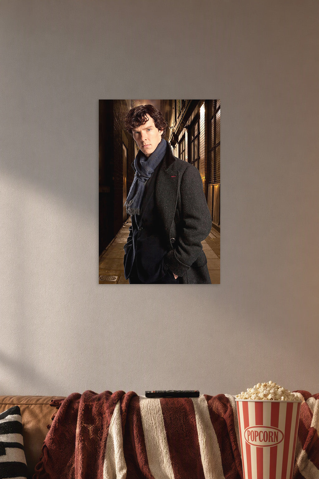 Sherlock Holmes in a cozy movie room above a brown sofa with popcorn.