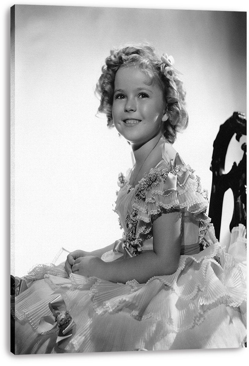 Shirley Temple canvas wall art print displays a black-and-white portrait of her seated in an ornate ruffled gown.