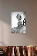 Shirley Temple in a cozy movie room above a brown sofa with popcorn.